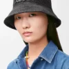 Bucket-hatt i raffia og kalveskinn