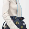«Cats» medium Flamenco-clutch i brodert denim «Cats» medium Flamenco-clutch i brodert denim