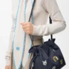 «Cats» medium Flamenco-clutch i brodert denim «Cats» medium Flamenco-clutch i brodert denim