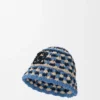 Hatt med patch i raffia og kalveskinn Hatt med patch i raffia og kalveskinn
