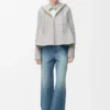 Jakke med hette i shearling Jakke med hette i shearling