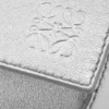 Liten Puzzle Edge-veske i laminert lammeskinn Liten Puzzle Edge-veske i laminert lammeskinn