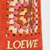 Lomme med snøring i klassisk kalveskinn og raffia Lomme med snøring i klassisk kalveskinn og raffia