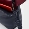 Mini-lagdelt Flamenco-clutch i nappa-kalveskinn