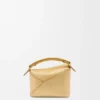 Mini Puzzle Edge-veske i laminert lammeskinn Mini Puzzle Edge-veske i laminert lammeskinn