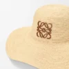 Solhatt i raffia og kalveskinn Solhatt i raffia og kalveskinn