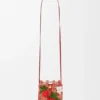 Strawberry-lomme med snøring i klassisk kalveskinn og raffia Strawberry-lomme med snøring i klassisk kalveskinn og raffia
